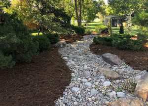 A landscape path made of river rocks.